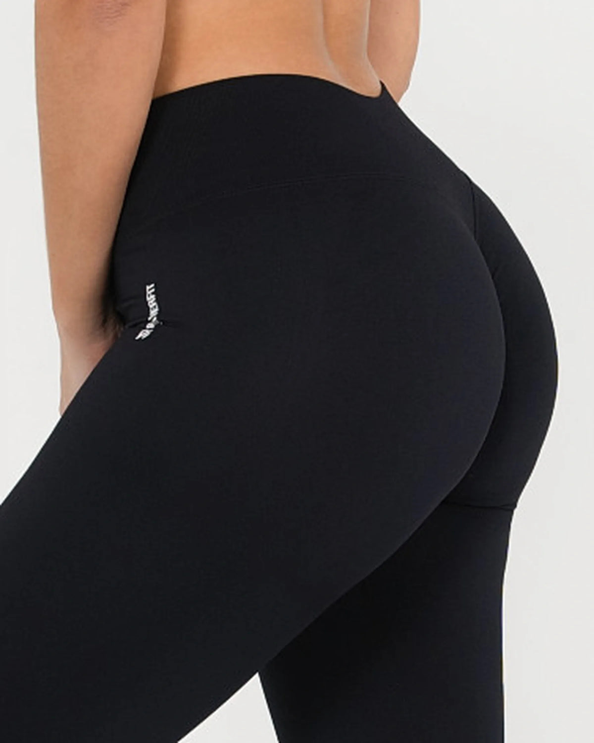 Legging ICÔNE noir Reaverfit pour femme, détail ceinture et logo.