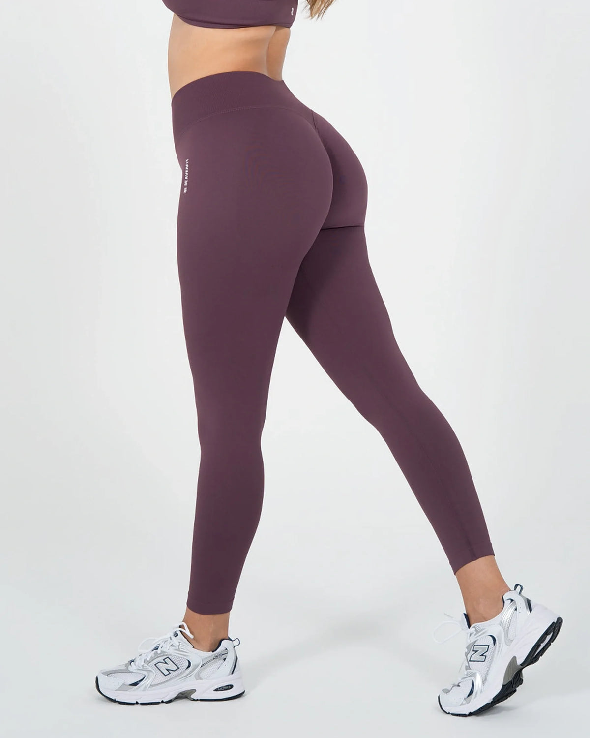 Legging ICÔNE violet Reaverfit pour femme, vue de profil.