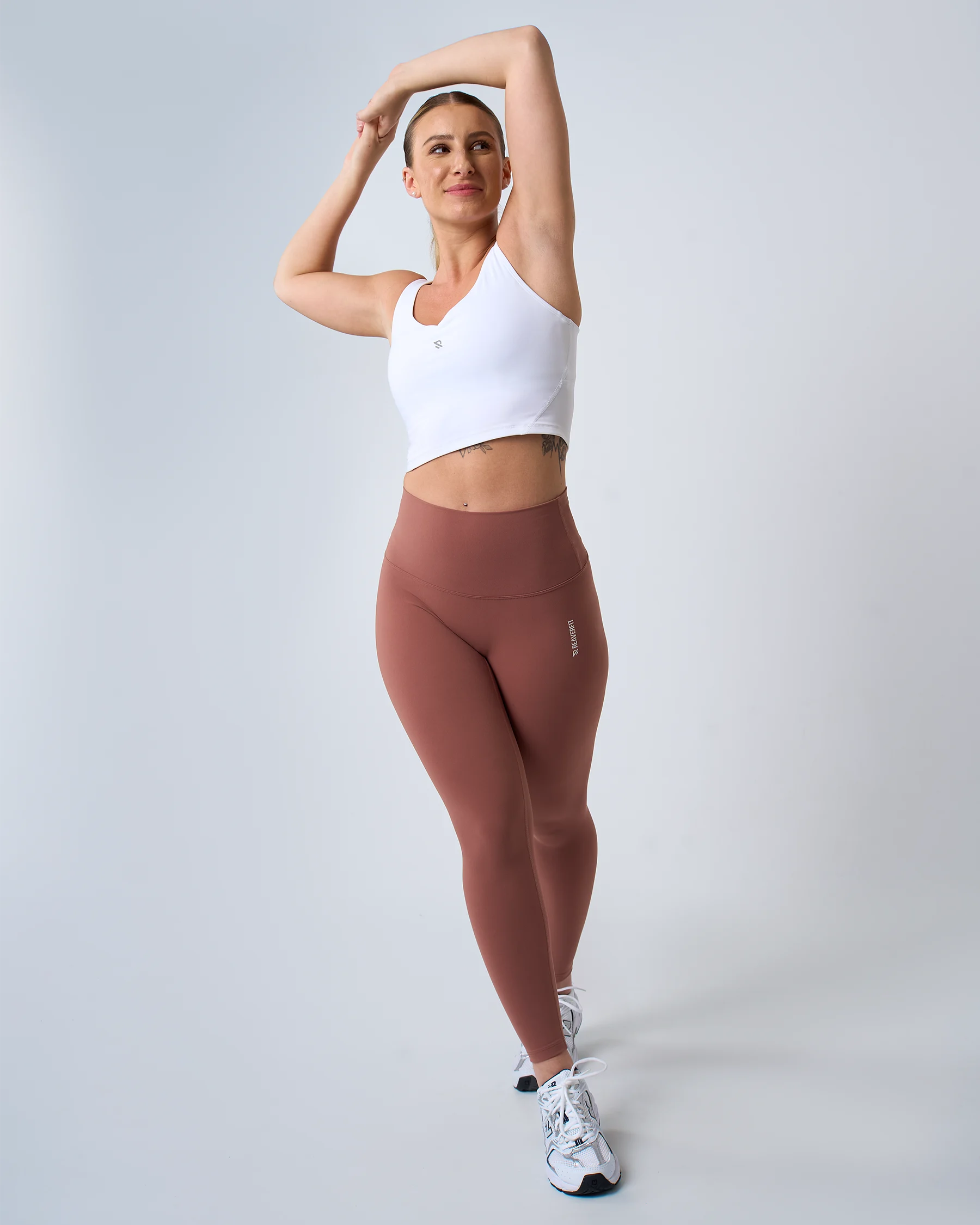 Legging fitness blush LUXE pour femme, taille haute et extensible, idéal pour les séances de yoga et de pilates.