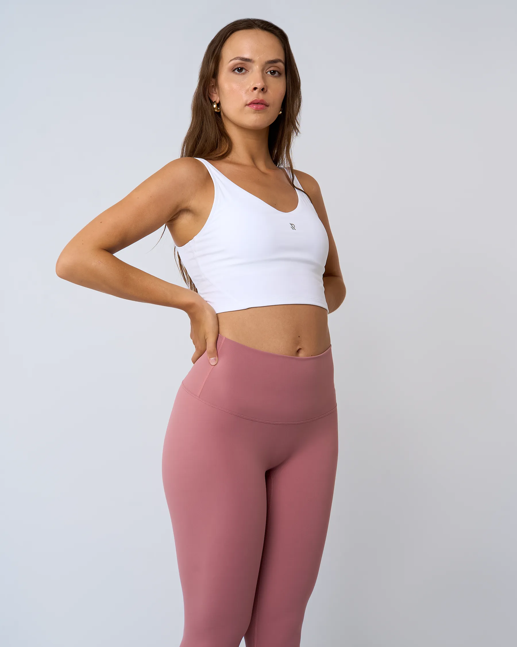 Legging fitness rose LUXE pour femme, ultra-confortable et extensible, adapté pour un look sporty chic et quotidien.