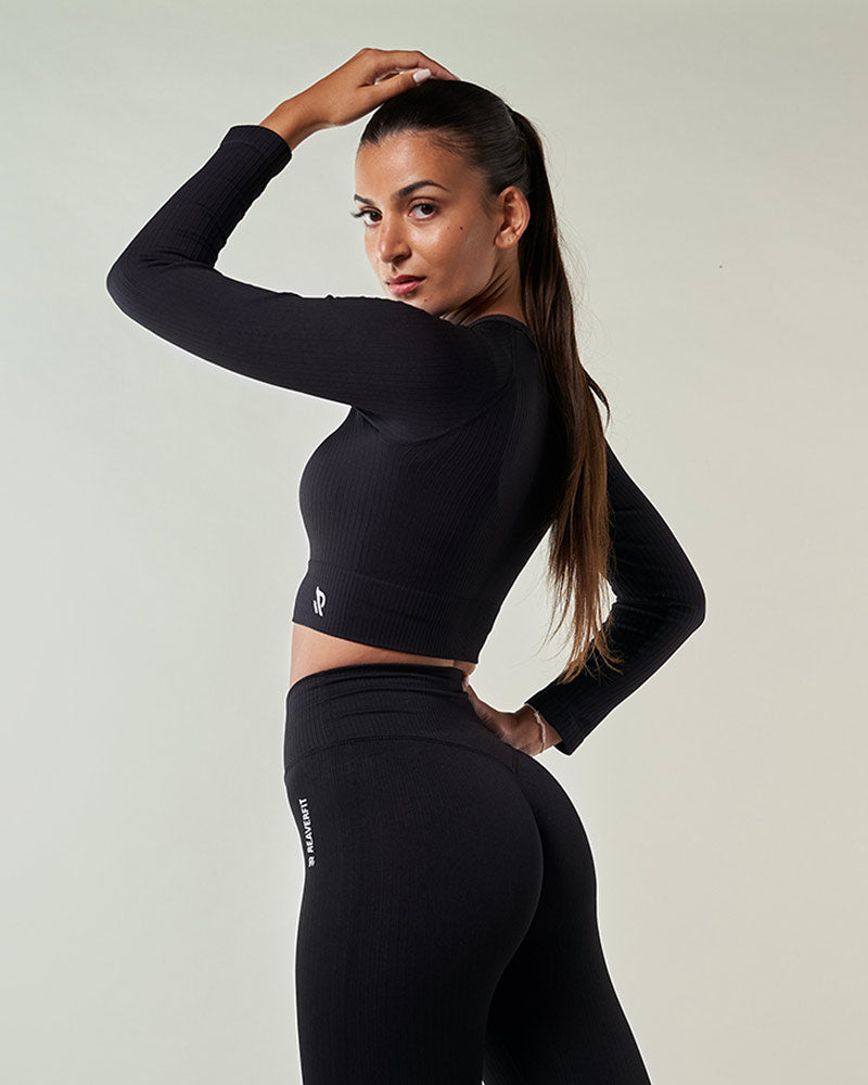 vetement sport femme Crop top sport manche longues noir pour femme silhouette athlétique Conçu pour soutenir vos mouvements et sublimer votre look activewear